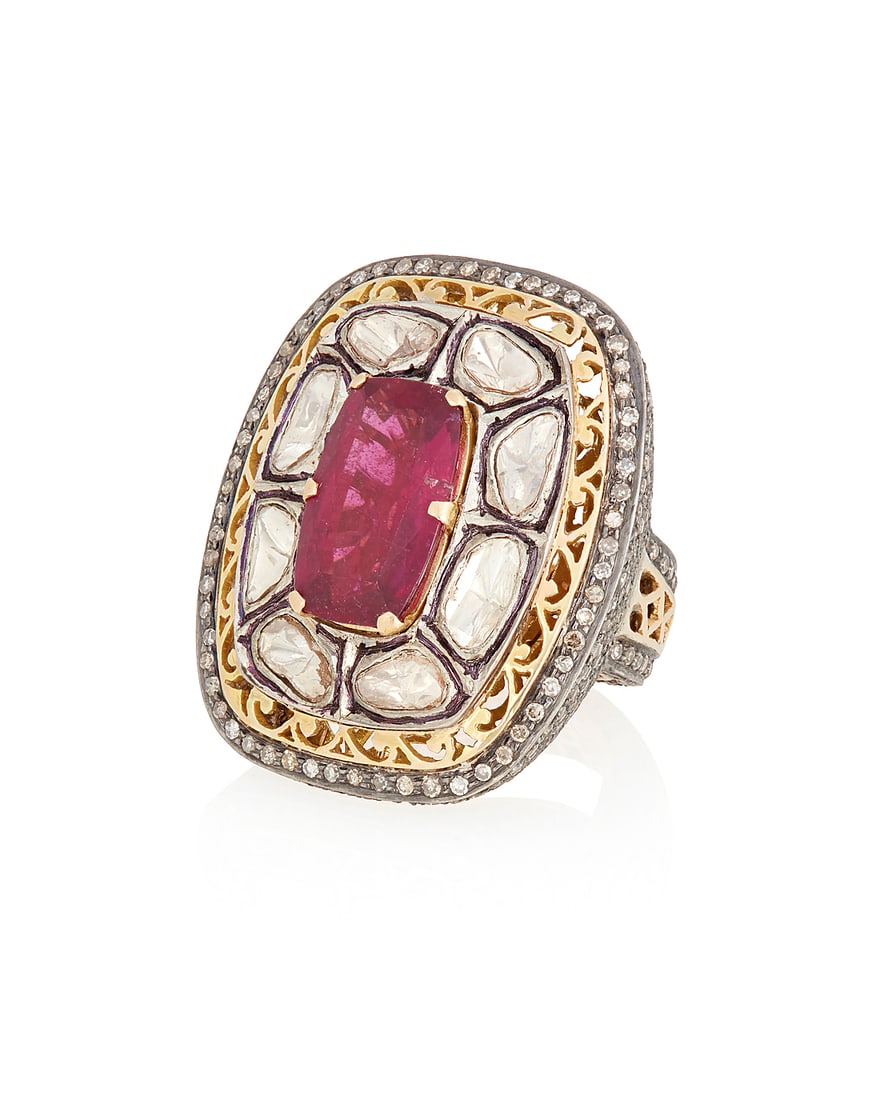 A Gold, Pink Tourmaline and Diamond Ring: A Gold, Pink Tourmaline and Diamond Ring Centering a rectangular cushion-cut pink tourmaline measuring approximately 16.70 x 10.40 mm, accented by round and sliced diamonds all set in a mogul style