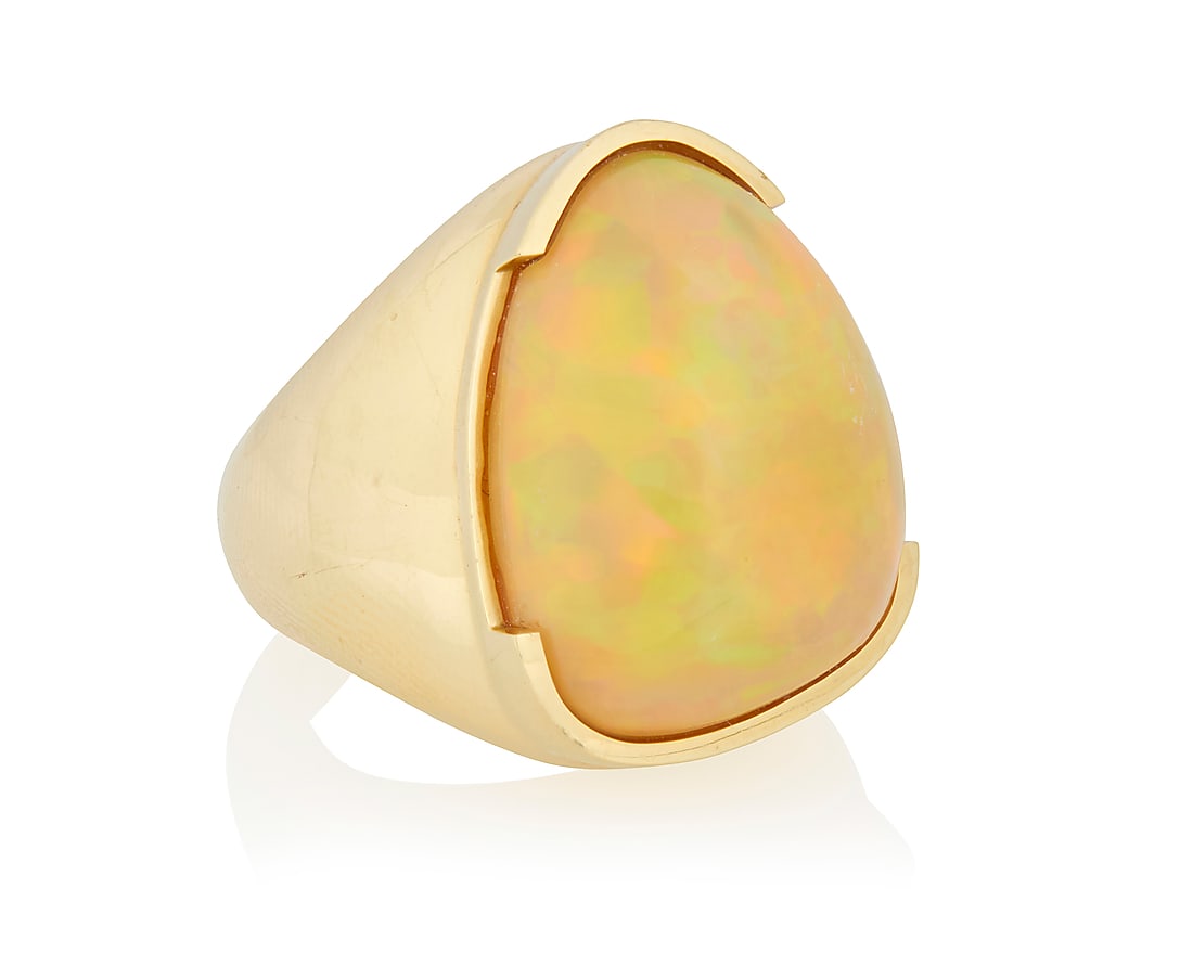 A 14K Gold and Opal Ring: A 14K Gold and Opal Ring Featuring an abstract opal cabochon measuring approximately 24.78 x 18.60 x 9.66 mm, set in a high polish design Size: 10 1/4 24.5 grams gross