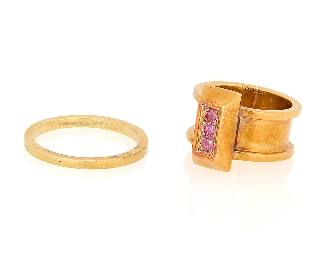 Tiffany & Co.: Two Gold Rings: Tiffany & Co.: Two Gold Rings Including a 14k gold band signed Tiffany & Co., together with an 18k gold and ruby ring signed Tiffany 2 pieces Sizes: 3 3/4 and 7 14.7 grams gross This lot is being