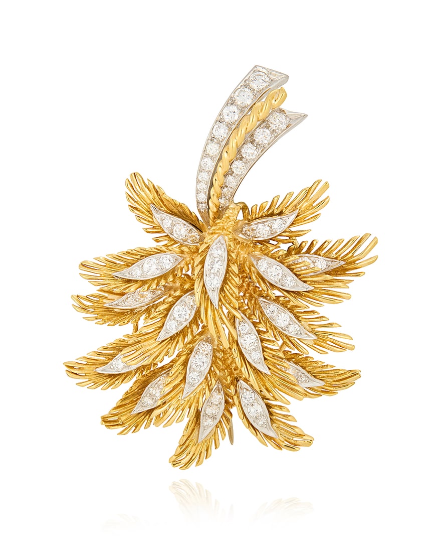 An 18K Gold, Platinum and Diamond Brooch: An 18K Gold, Platinum and Diamond Brooch Of a foliate design accented by round diamonds weighing approximately 1.64 carats, with makers mark Measures: 2 1/4 x 1 1/2 in. 23.0 grams gross