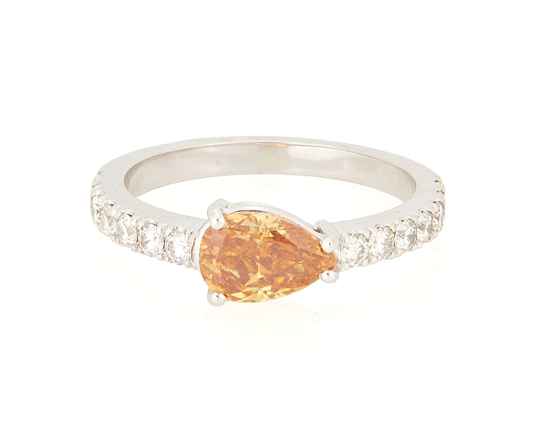 An 18K White Gold, Fancy Deep Yellowish Orange Diamond and Diamond Ring: An 18K White Gold, Fancy Deep Yellowish Orange Diamond and Diamond Ring Centering a pear modified brilliant-cut Fancy Deep Yellowish Orange diamond weighing 1.04 carat, accented by round diamonds