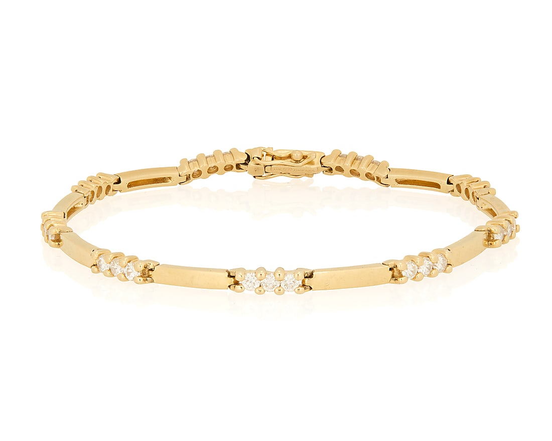 A 14K Gold and Diamond Bracelet: A 14K Gold and Diamond Bracelet Featuring high polish bar links accented by connectors featuring round diamonds weighing approximately 0.80 carat Length: 7 1/2 in. 11.1 grams