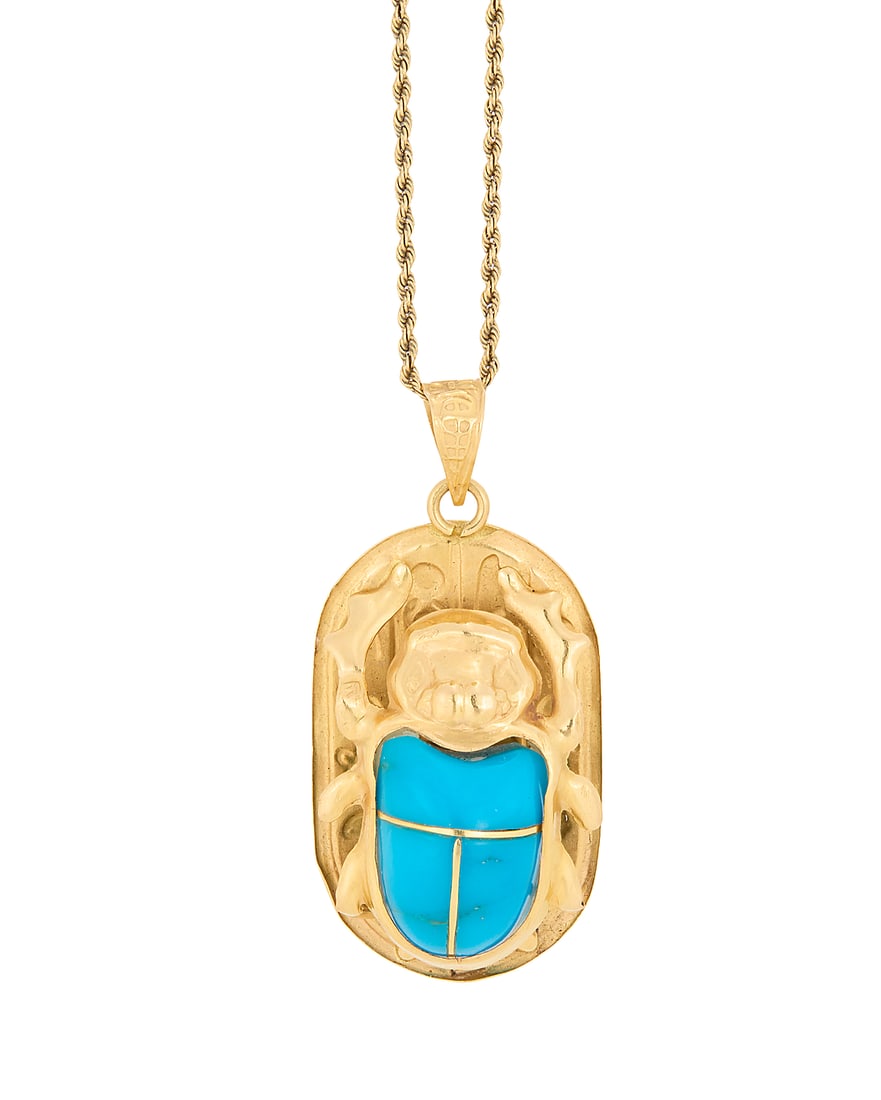 A Gold and Turquoise Necklace: A Gold and Turquoise Necklace Featuring a 14k gold rope chain suspending an 18k gold and turquoise scarab pendant Chain: 19 in., Pendant: 1 1/2 x 3/4 in. 8.2 grams gross