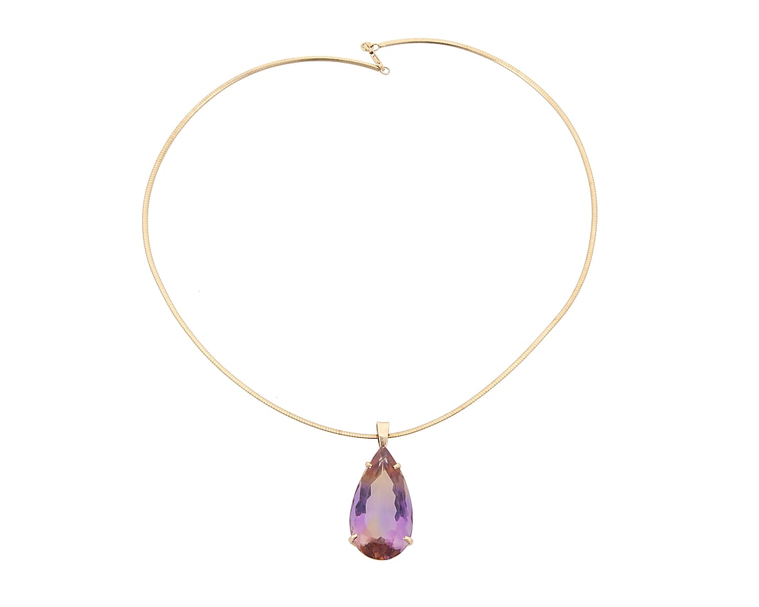 A 14K Gold and Ametrine Pendant Necklace: A 14K Gold and Ametrine Pendant Necklace Featuring an omega chain suspending a pear-shaped ametrine weighing approximately 31.08 carats Chain: 18 in., Pendant: 1 3/4 in. 17.4 grams gross