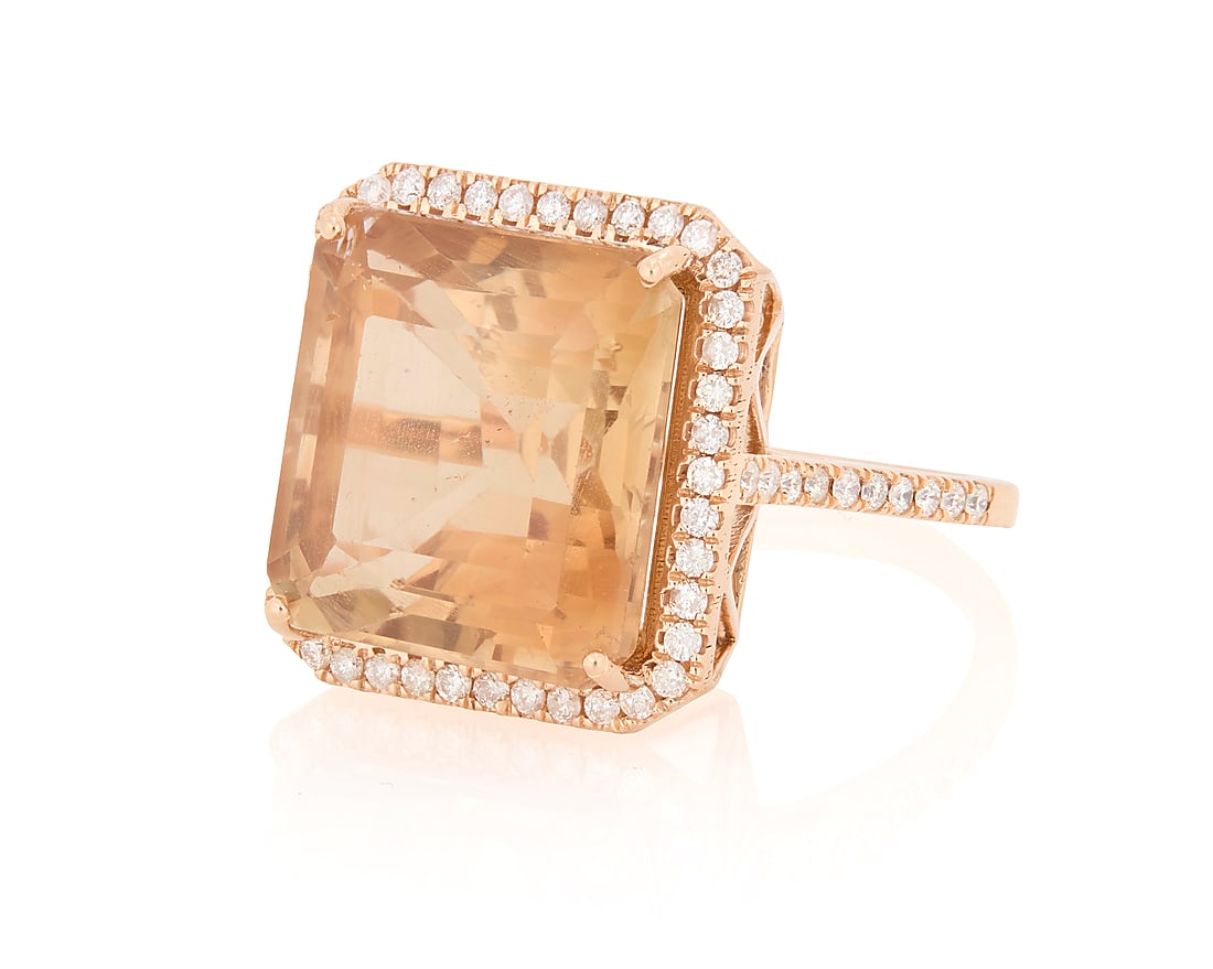 An 18K Rose Gold, Topaz, and Diamond Ring: An 18K Rose Gold, Topaz, and Diamond Ring Centering a square emerald-cut topaz weighing appropriately 14.60 carats, accented by round diamonds in an openwork design Size: 6 3/4 8.3 grams gross