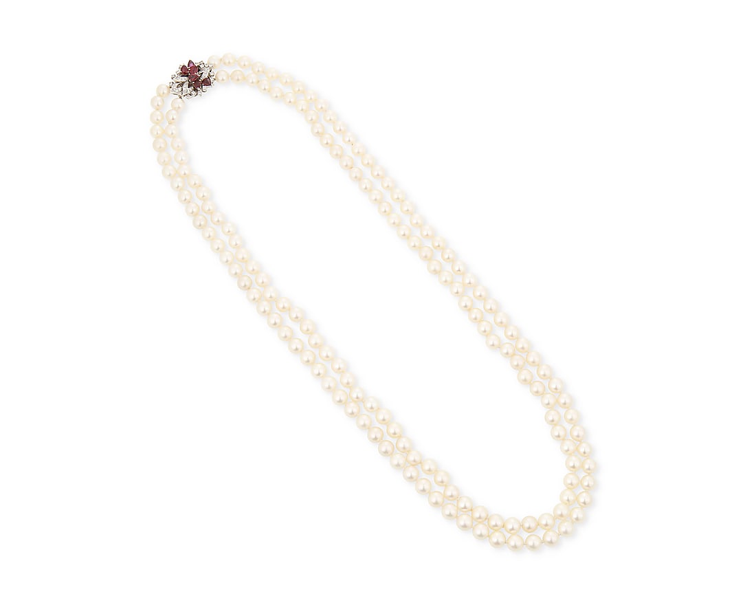 A White Gold, Cultured Pearl and Ruby Necklace: A White Gold, Cultured Pearl and Ruby Necklace Featuring two nested strands of cultured pearls measuring approximately 7.50 mm, finished with a 12k white gold, pear-shaped ruby and round diamond
