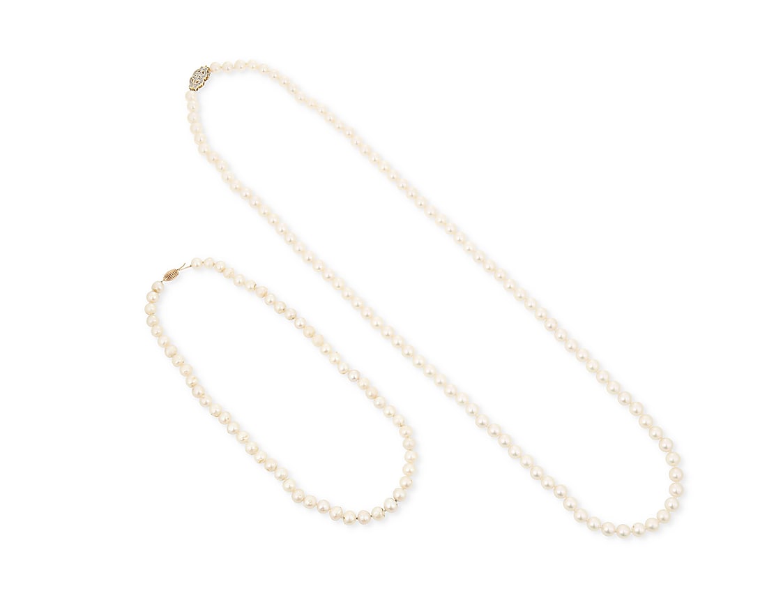 A Group 14K Gold and Two Cultured Pearl Necklaces: A Group 14K Gold and Two Cultured Pearl Necklaces Both of a single strand design featuring cultured pearls measuring approximately 7.40 - 8.30 mm, finished with gold clasps 2 pieces Lengths: 35.0