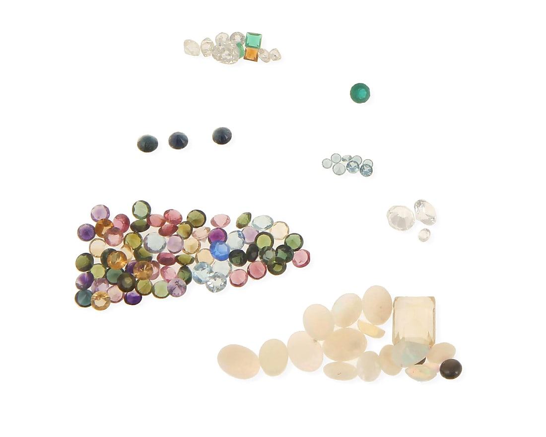 A Group of Loose Gemstones: A Group of Loose Gemstones Including various cuts of opal, tourmaline, garnet, spinel, turquoise, topaz, sapphires and emeralds loose and some in papers in the box