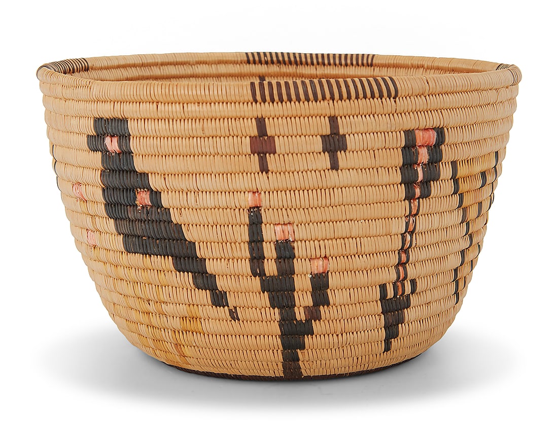 A Panamint Shoshone polychrome pictorial basket: A Panamint Shoshone polychrome pictorial basket Early 20th century; Great Basin The coiled basket with partial rim ticking above alternating birds on a branch, arrows, flowering cacti, and butterfly m