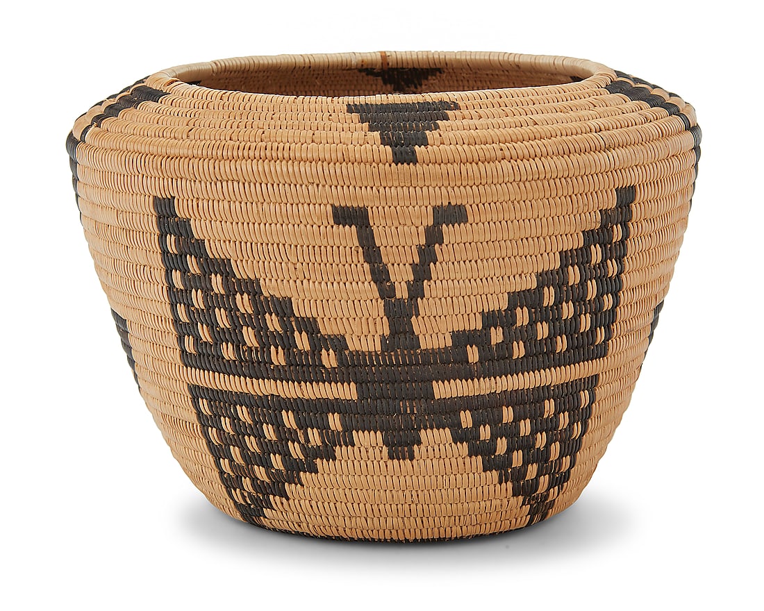 A Panamint Shoshone pictorial basket: A Panamint Shoshone pictorial basket Early 20th century; Great Basin The coiled vessel with angled shoulders, worked with alternating stacked triangles and moth motifs 4.125" H x 5.875" Dia. Provenanc