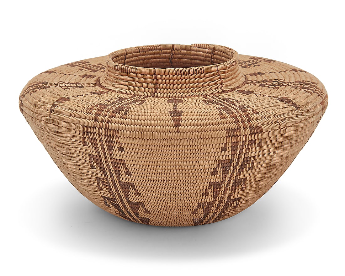 A Panamint Shoshone bottleneck basket: A Panamint Shoshone bottleneck basket Early 20th century; Great Basin The coiled basket with partial rim ticking above a wide, flat shoulder issuing seven hooked columns alternating with arrows 4.625"