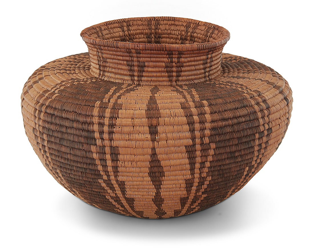 A Panamint Shoshone bottleneck basket: A Panamint Shoshone bottleneck basket Early 20th century; Great Basin The coiled basket with five columns of graduated serration 5.625" H x 8.75" Dia. Provenance: The Robert Stuart Schaefer Collection