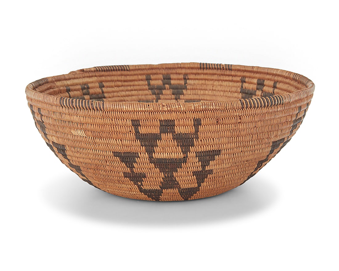A Panamint Shoshone basketry bowl: A Panamint Shoshone basketry bowl Early 20th century; Central California The coiled bowl with partial rim ticking above six arrangements of stacked triangles 3" H x 7.75" Dia. Provenance: The Robert S