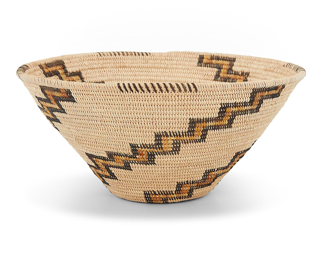 A Panamint Shoshone polychrome basketry bowl: A Panamint Shoshone polychrome basketry bowl Mid-20th century; Great Basin The coiled bowl with partial rim ticking above gap stitched radiating stepped arms issuing from center 4.875" H x 9.875" Dia.