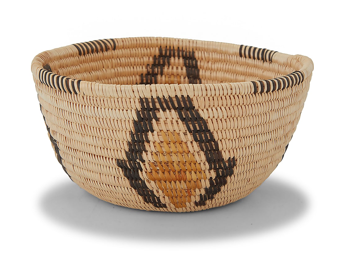 A Panamint Shoshone polychrome basketry bowl: A Panamint Shoshone polychrome basketry bowl Early 20th century; Great Basin The petite coiled bowl with partial rim ticking above four near-diamond designs 2.375" H x 4.75" Dia. Provenance: The Rober
