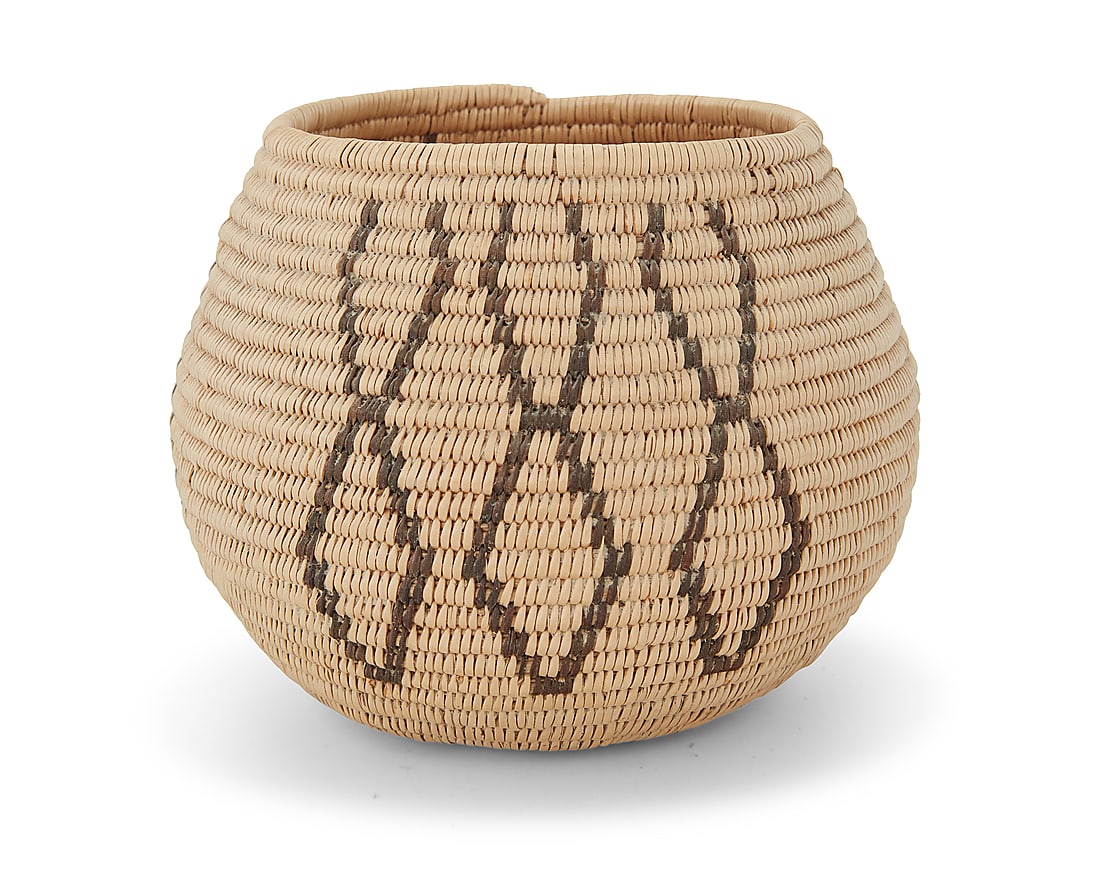 A Washoe basketry bowl: A Washoe basketry bowl Early/mid-20th century; Great Basin The coiled bowl with three groups of three columns of stacked diamonds 3.625" H x 4.75" Dia. Provenance: The Robert Stuart Schaefer