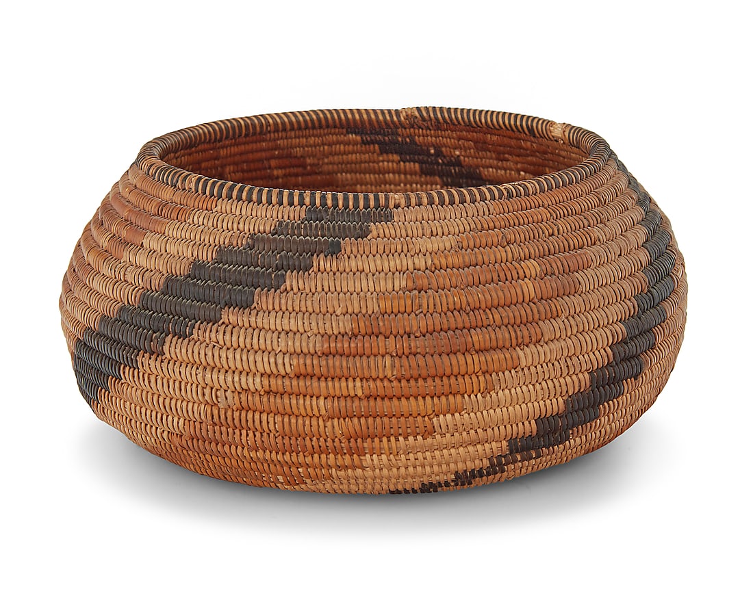 A California Mission polychrome basketry bowl: A California Mission polychrome basketry bowl Early 20th century; Southern California The coiled bowl with rim ticking above radiating arms issued from center to rim 3.125" H x 6.625" Dia.