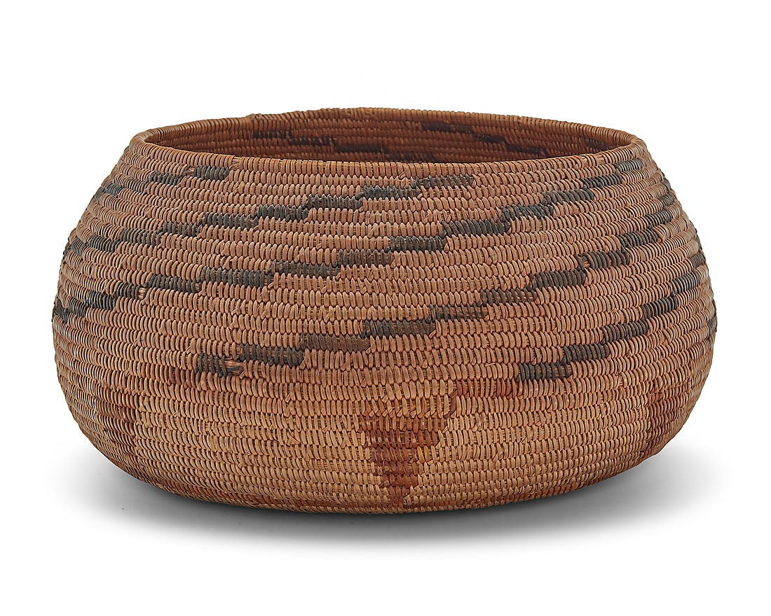 A California Mission polychrome basketry bowl: A California Mission polychrome basketry bowl Early 20th century; Southern California The coiled bowl with stepped arms radiating to rim above inverted triangular floating elements to base 4.875" H x