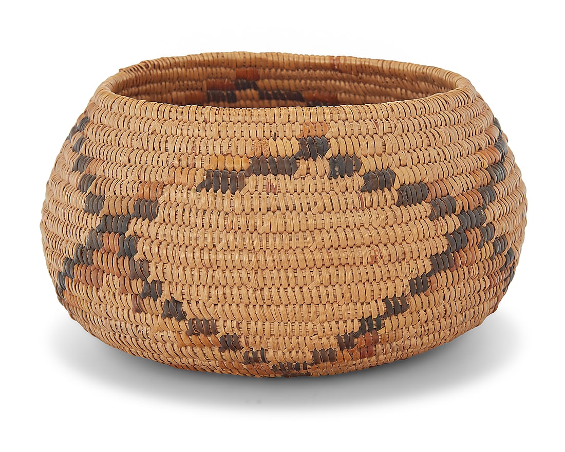 A California Mission polychrome basketry bowl: A California Mission polychrome basketry bowl Early 20th century; Southern California The coiled bowl with a lattice motif above central star to base 4" H x 7.625" Dia. Provenance: The Robert Stuart
