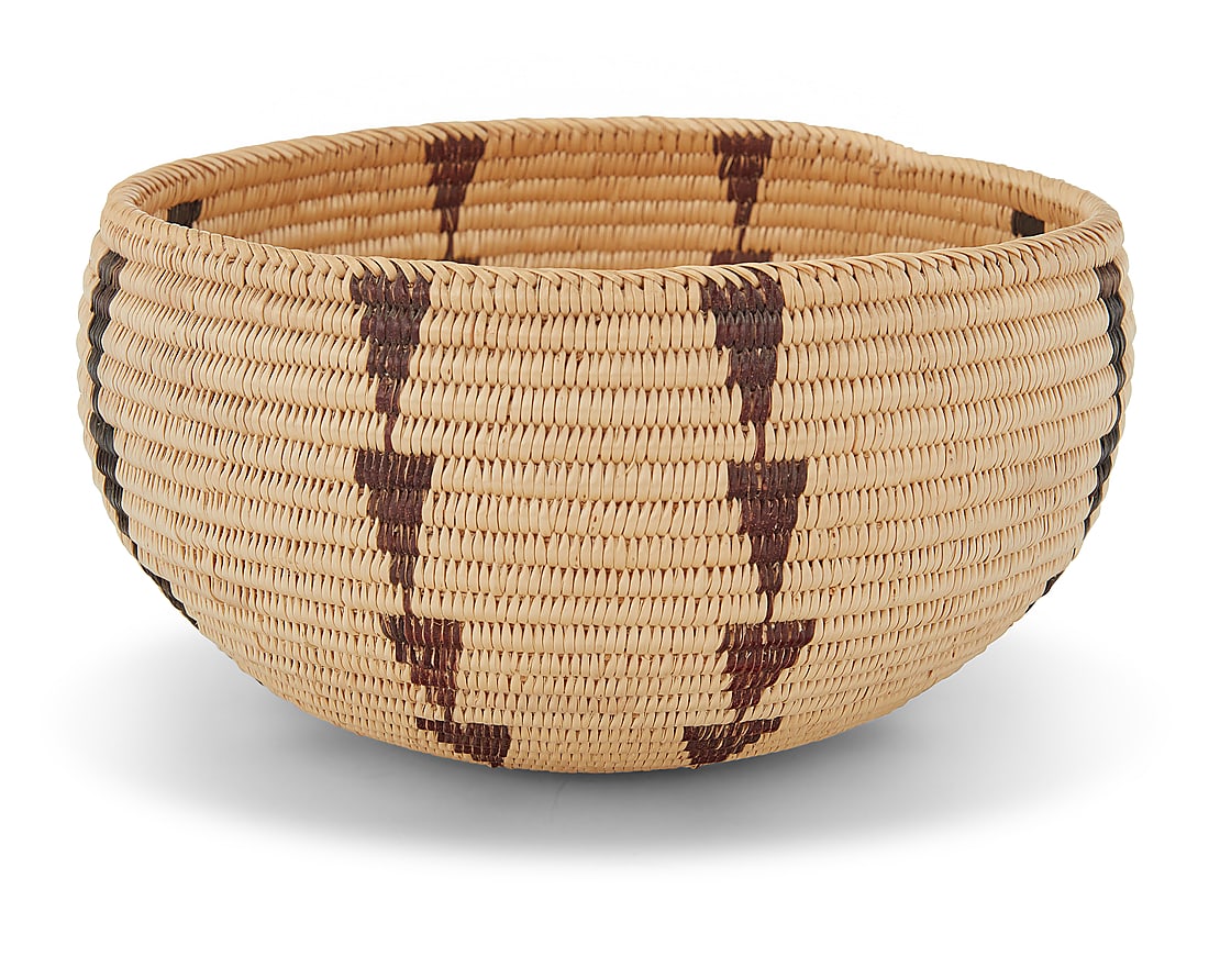 A Paiute polychrome basketry bowl: A Paiute polychrome basketry bowl Early 20th century; Great Basin The coiled bowl with diagonal-stitch rim above columns of inverted stacked triangles 3.75" H x 7.5" Dia. Provenance: The Robert