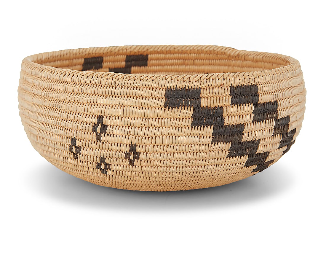 A Paiute basketry bowl: A Paiute basketry bowl Early 20th century; Great Basin The coiled bowl with a diagonal-stitch rim above a cluster of floating elements and stepped arms 3" H x 7" Dia. Provenance: The Robert Stuart