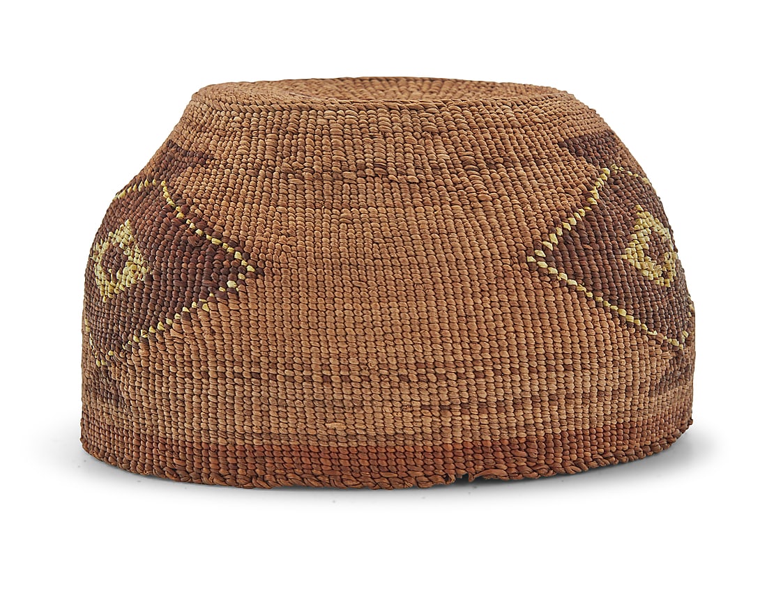 A Klamath polychrome basketry hat: A Klamath polychrome basketry hat Early 20th century; Northern California/Oregon The twined hat with diamond lozenges enhanced with imbricated quillwork 3.75" H x 6.75" Dia. Provenance: The Robert