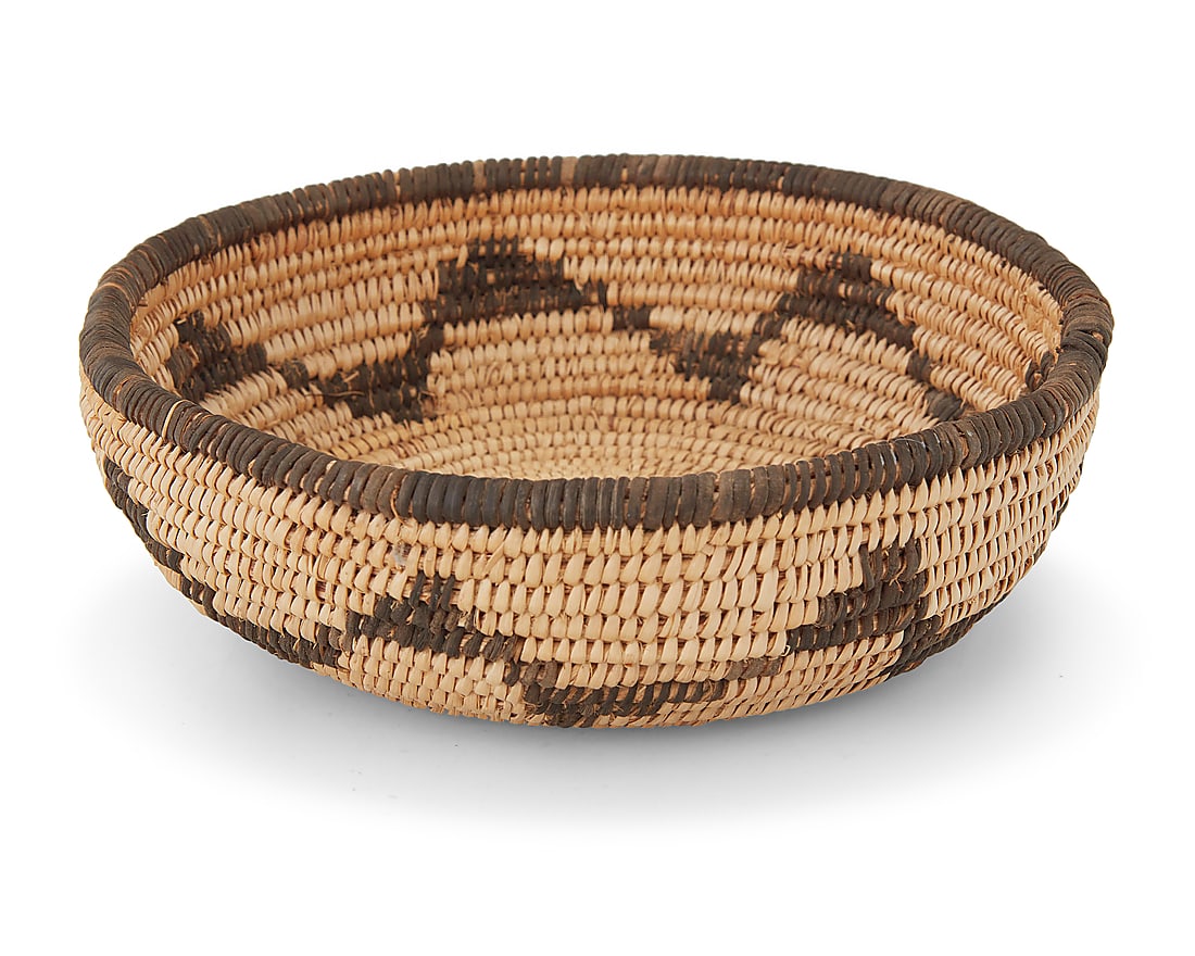 A small Chemehuevi basketry bowl: A small Chemehuevi basketry bowl Early 20th century; Southwest United States The coiled bowl with a sawtooth band along the body 2.25" H x 6.5" Dia. Provenance: The Robert Stuart Schaefer Collection,