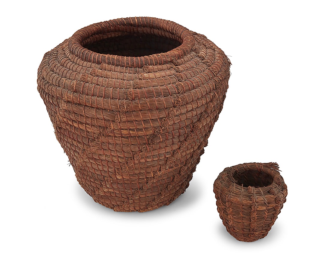 Two Native American pine needle storage baskets: Two Native American pine needle storage baskets Early 20th century A large pine needle basket, together with a smaller version 2 pieces Larger: 19.75" H x 20.75" Dia.; Smaller: 7.25" H x 7.75" Dia.