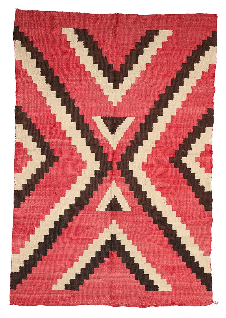 A Navajo regional rug: A Navajo regional rug Early 20th century, Dine Woven in red, dark brown, and cream wool, with stepped half-diamonds 65.5" H x 44.75" W Provenance: The Robert Stuart Schaefer Collection, Independence,