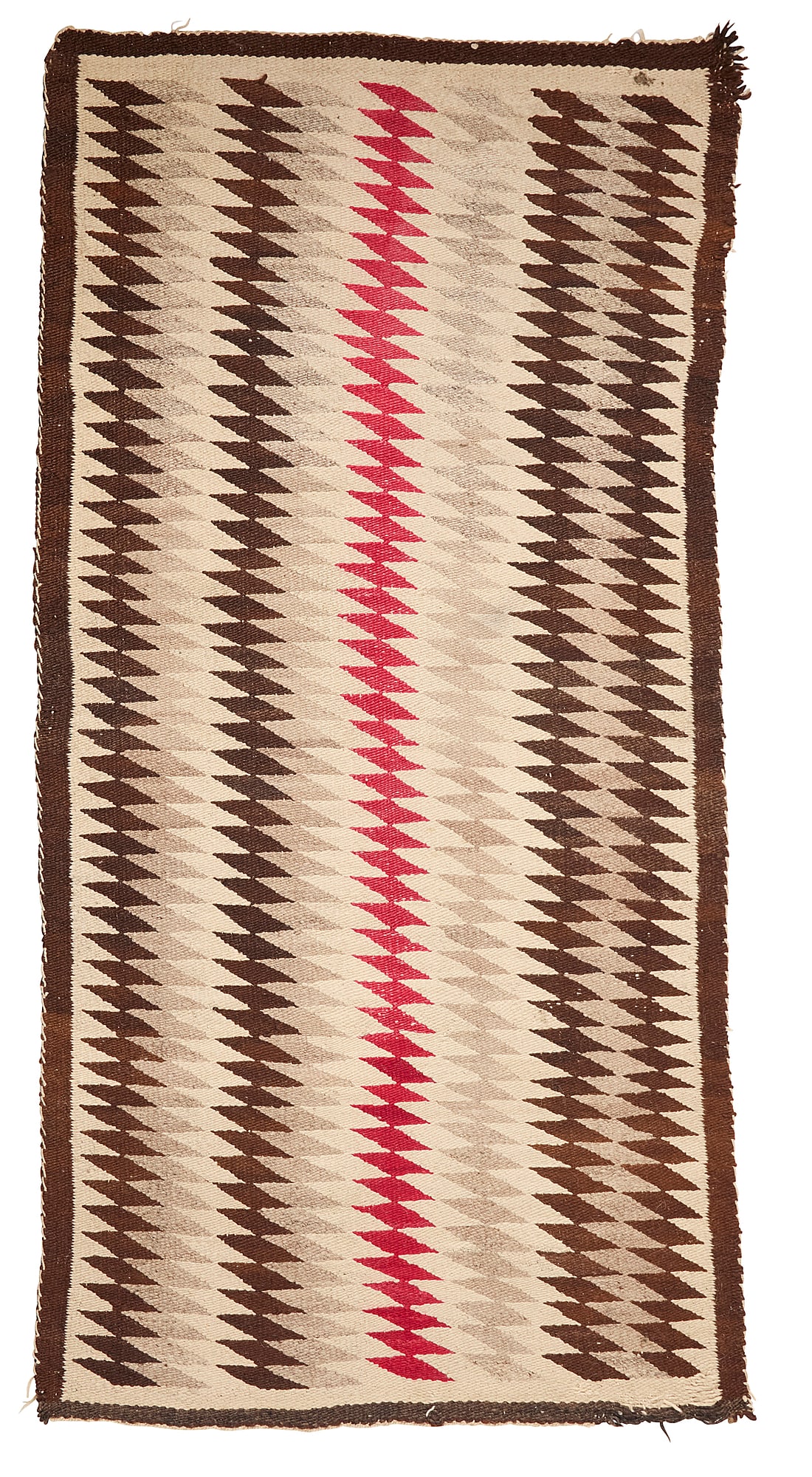 A Navajo regional rug: A Navajo regional rug Early 20th century, Dine Woven in red, dark brown, cream, and natural grey wool, with eyedazzler motif 80.5" H x 39.5" W Provenance: The Robert Stuart Schaefer Collection,