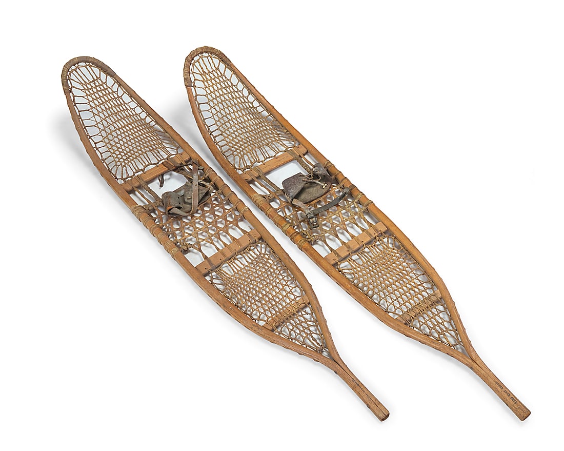 A pair of Abercrombie & Fitch WWII military issue snowshoes: A pair of Abercrombie & Fitch WWII military issue snowshoes 1942 Each burn marked: AF H CO WALLINGFORD VT US / 10X58 / 1942 / 0614 Each with babiche webbing and wood frame, the pair of Abercrombie &