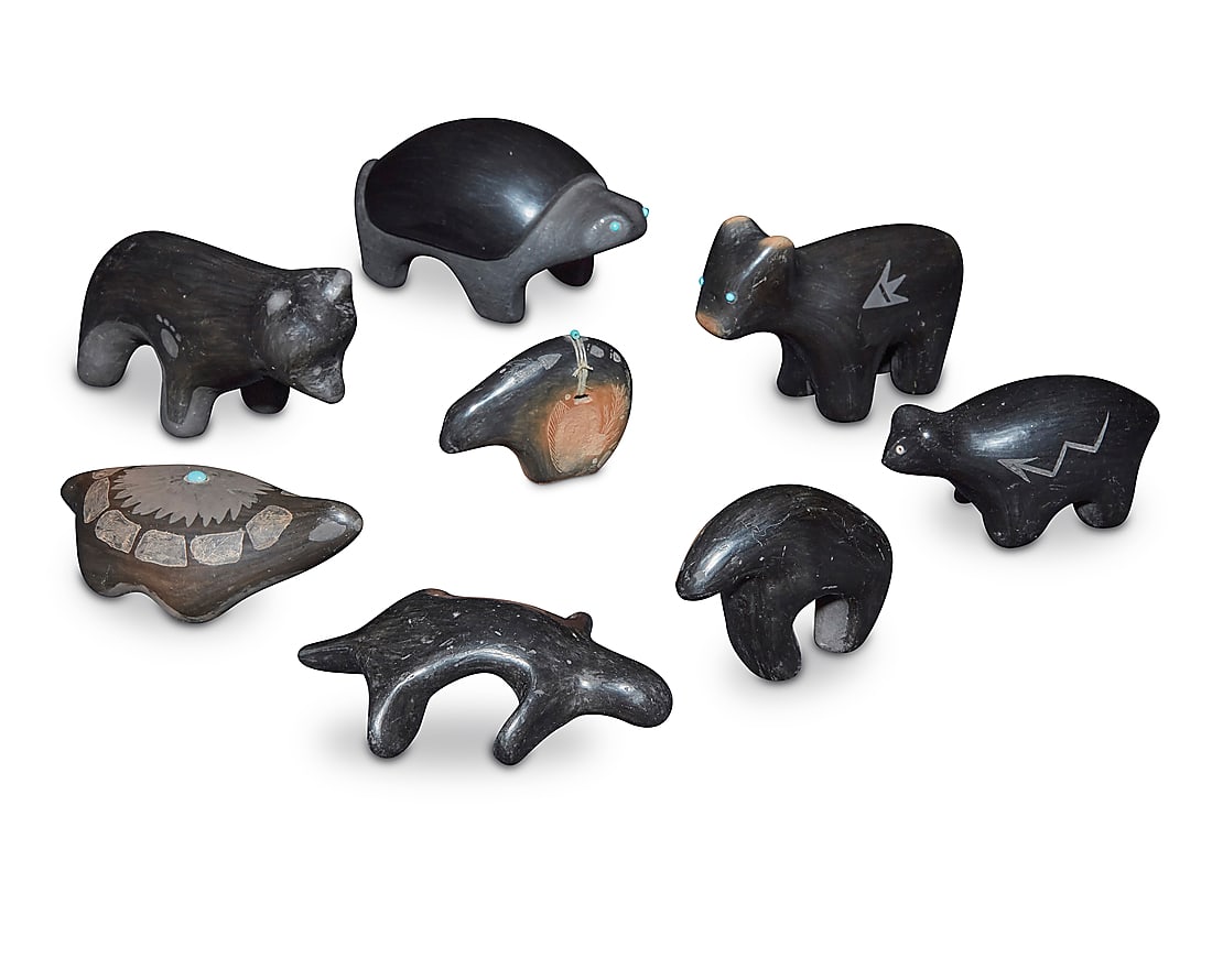 A group of eight Southwest Pueblo blackware pottery animals: A group of eight Southwest Pueblo blackware pottery animals Mid/late 20th century Five variously incised with signature, two inscribed 'M' or 'E', and one incised: RG [conjoined] Comprising four bears