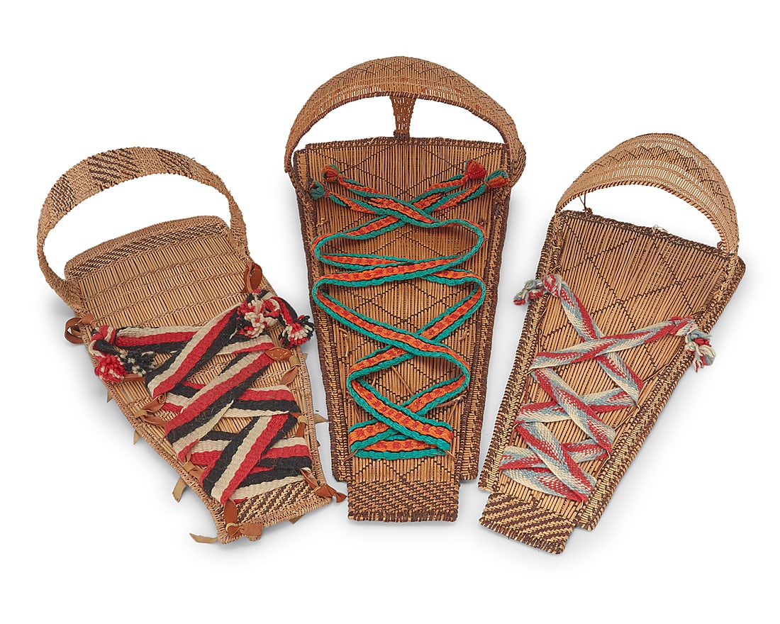 Three Mono basketry cradleboards: Three Mono basketry cradleboards Mid-20th century; Central California The twined cradleboards each with integral shaped hoods of varying sizes, and each with striped and diagonal banding and ticking