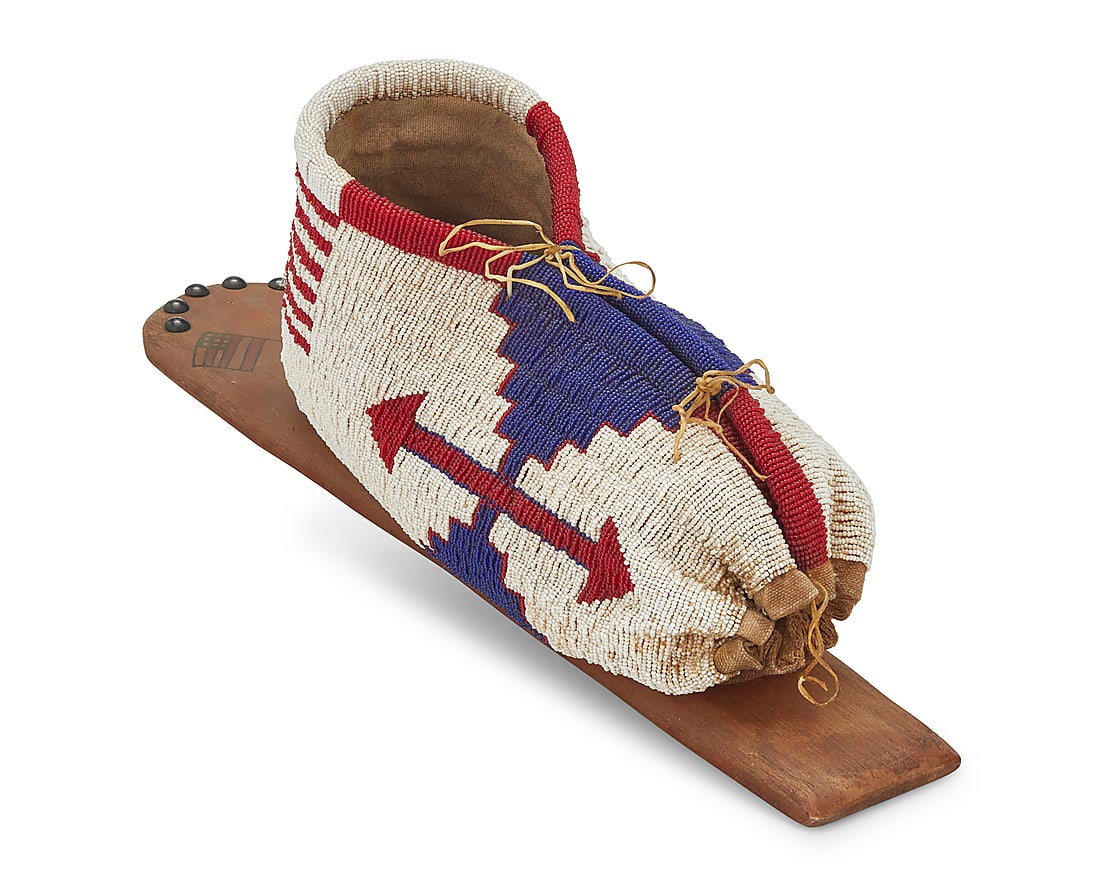 A Plains pictorial beaded hide doll cradle (1 of 7)