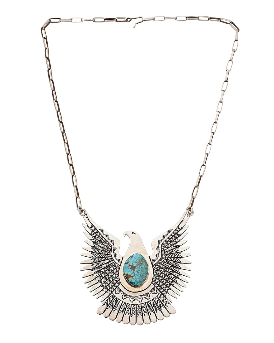 A Herman Vandever Navajo sterling silver eagle pendant necklace: A Herman Vandever Navajo sterling silver eagle pendant necklace Herman Vandever (b. 1964, Dine) Late 20th/21st century Etched signature verso Featuring a large incised silver eagle pendant with a cent