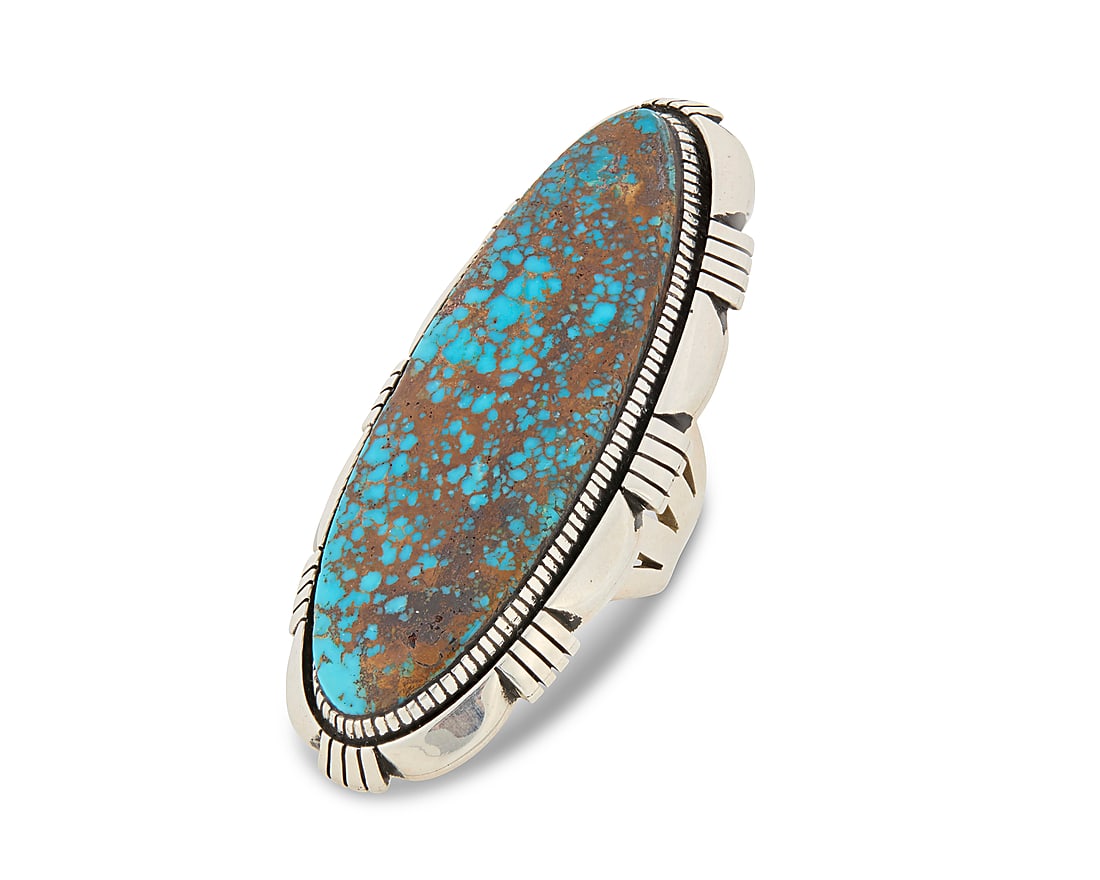 A Herman Vandever Navajo large sterling silver and turquoise ring: A Herman Vandever Navajo large sterling silver and turquoise ring Herman Vandever (b. 1964, Dine) Late 20th century Etched signature verso Featuring an extra-large sterling silver ring with an oval