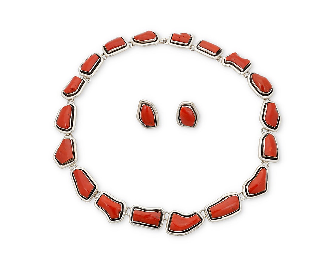 A set of Herman Vandever Navajo sterling silver and coral jewelry: A set of Herman Vandever Navajo sterling silver and coral jewelry Herman Vandever (b. 1964, Dine) Late 20th/21st century Etched signature verso A chunky silver link necklace with graduated irregular