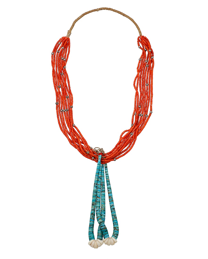 A Pueblo multistrand coral necklace with jaclas: A Pueblo multistrand coral necklace with jaclas Early/mid-20th century Unmarked An eight-strand dark red coral necklace with scattered silver pearls with a traditional wrapped neck cord, and