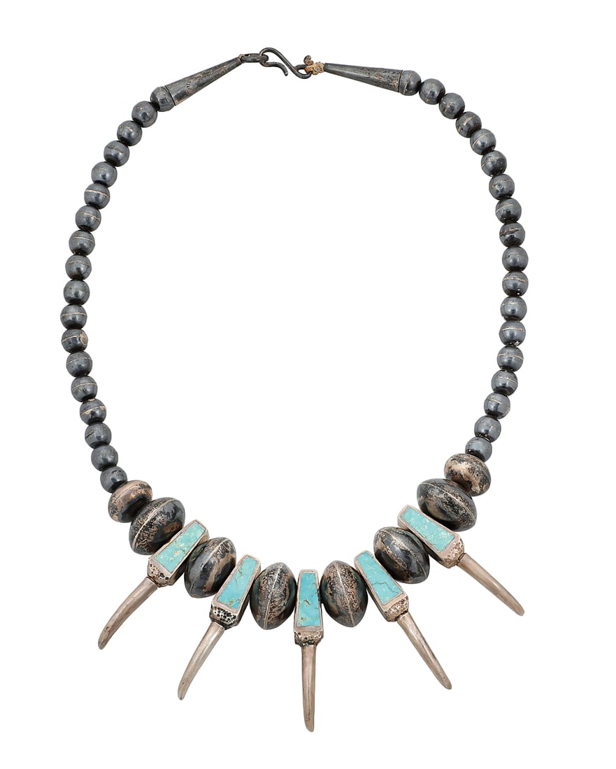 A Southwest sterling silver and turquoise 'bear claw' style necklace: A Southwest sterling silver and turquoise 'bear claw' style necklace Mid-20th century Unmarked A short chunky single strand necklace with sterling silver and turquoise inlay 'bear claws' alternating w