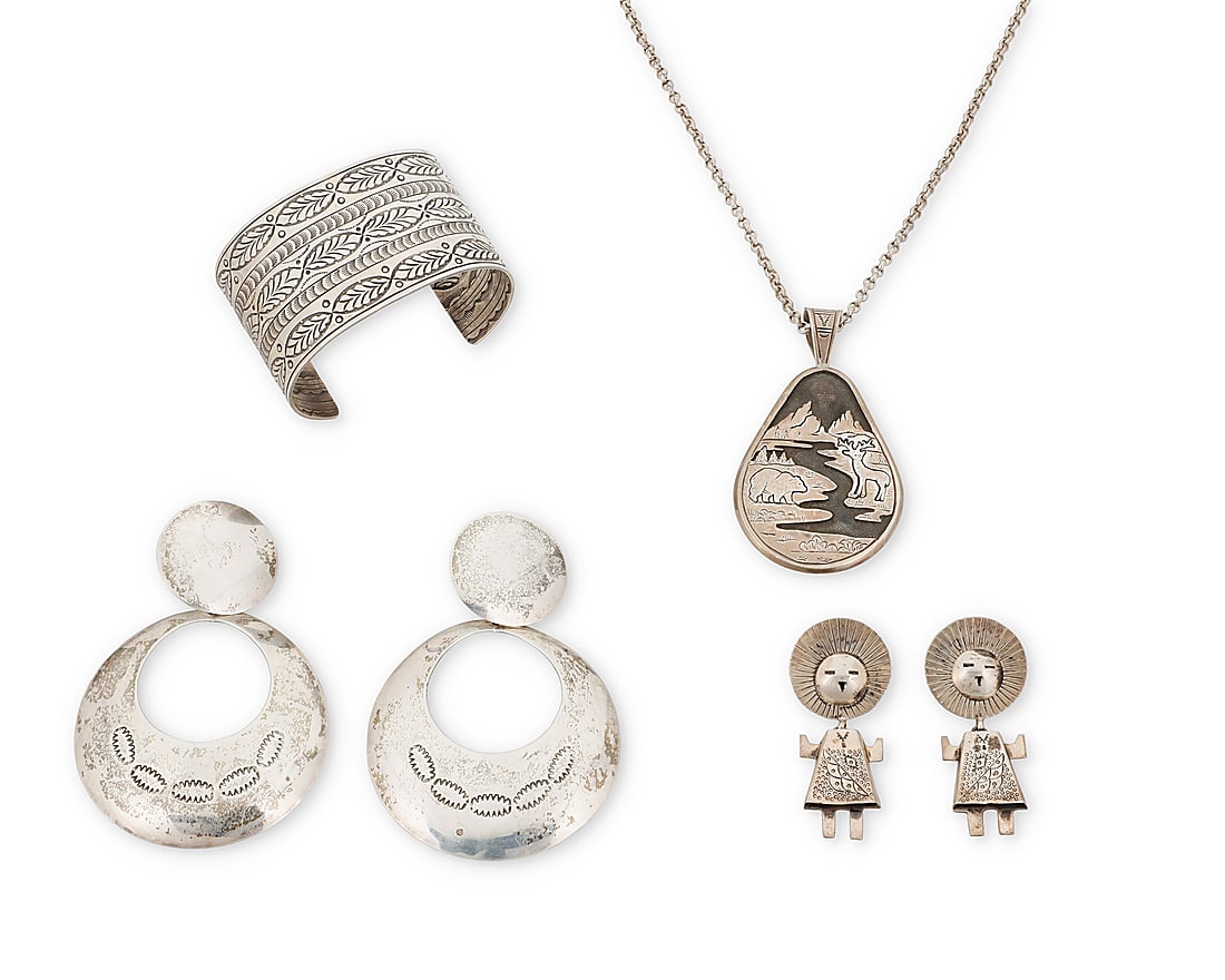 A group of Southwest silver jewelry: A group of Southwest silver jewelry Late 20th/21st century Four works: Fritson Toledo, (b. 1961, Dine) A Navajo sterling silver figural landscape teardrop pendant Stamped: Toledo / Sterling A chunky p