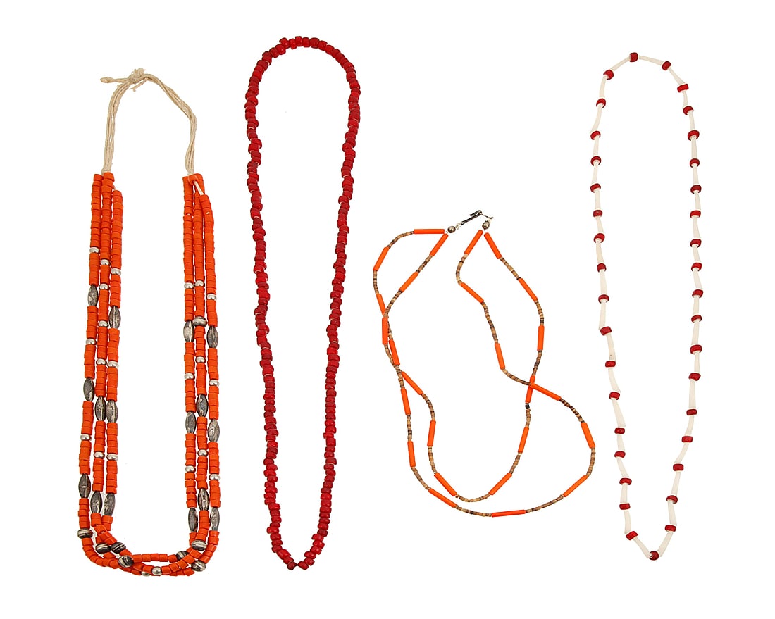 A group of Pueblo trade bead necklaces: A group of Pueblo trade bead necklaces Early/mid-20th century Unmarked Four necklaces comprising three strands of orange trade beads with silver bead spacers (31" L), a short double strand of orange t