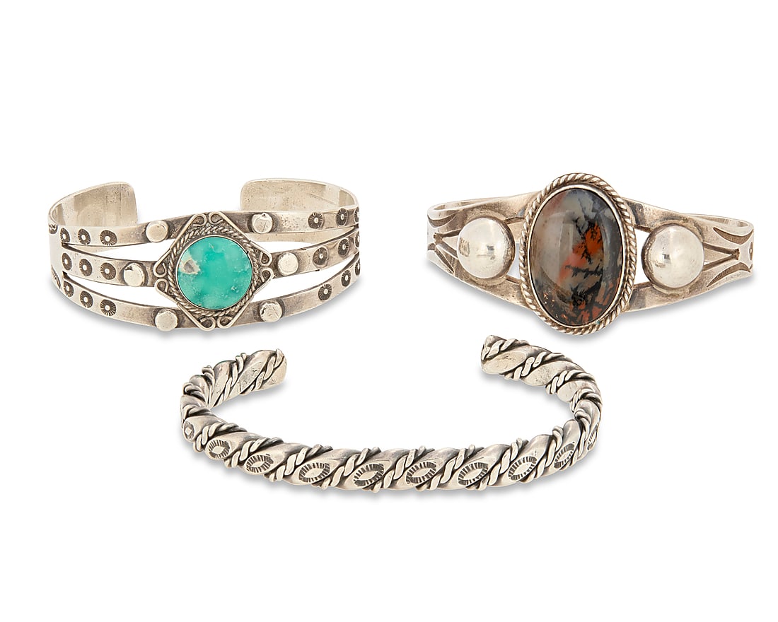 A group of Southwest style sterling silver cuff bracelets (1 of 3)