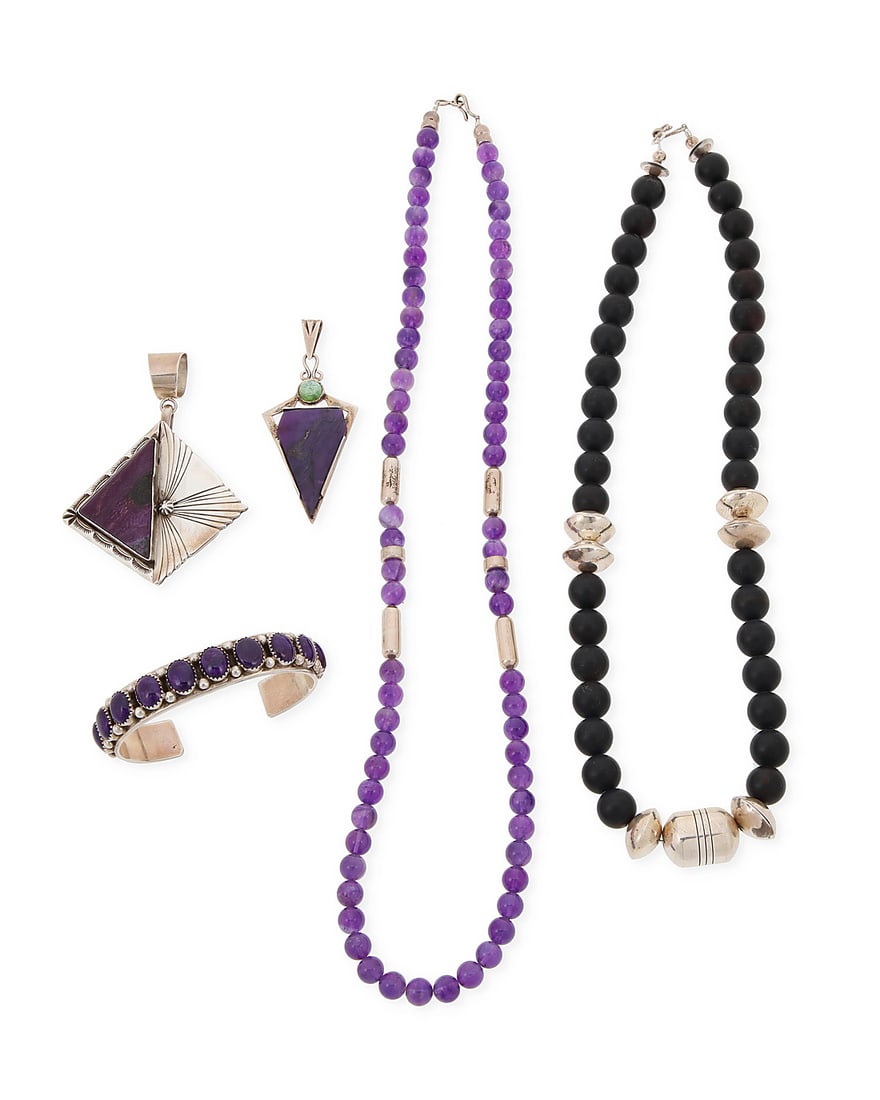 A group of Southwest style sterling silver and set stone jewelry: A group of Southwest style sterling silver and set stone jewelry Late 20th/21st century Five works: Esther Wood (b. 1946, Dine) A Navajo sterling silver and sugilite pendant With etched initials verso