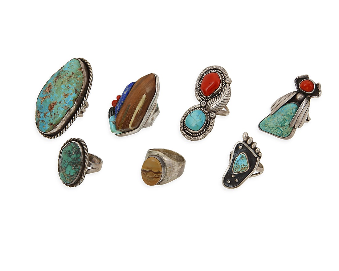 A group of large Southwest silver and turquoise rings: A group of large Southwest silver and turquoise rings Mid/late 20th century Each unmarked Seven rings in various styles including an insect ring, bezel set stones, shadow box and sculptural stone inla