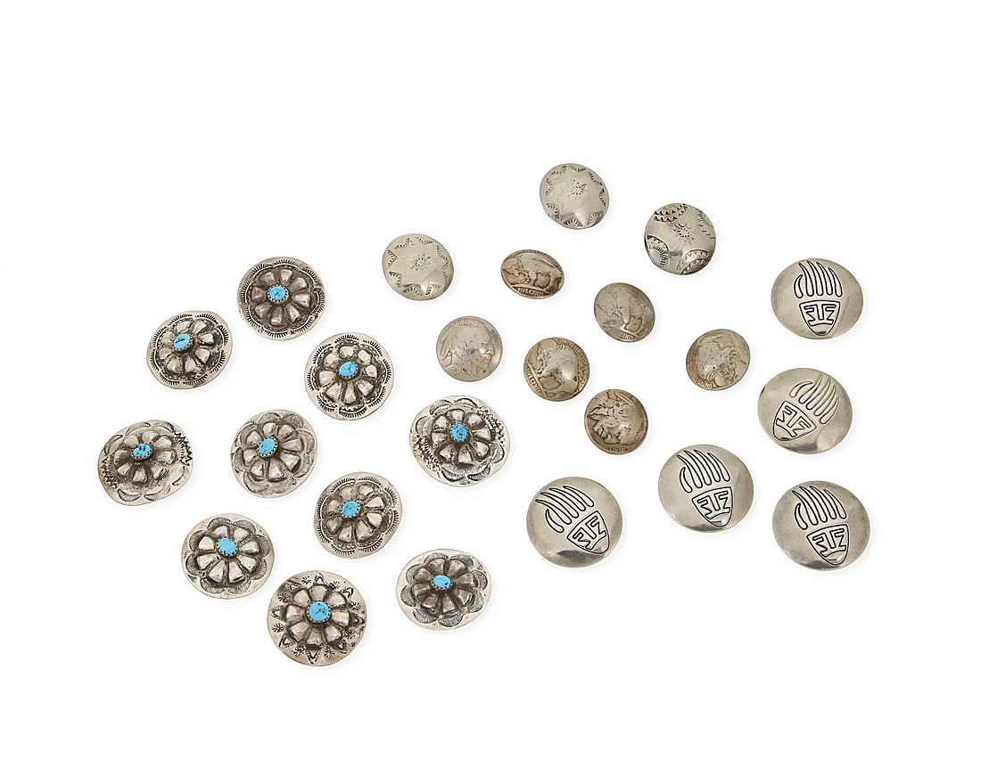A group of Southwest style silver buttons and button covers: A group of Southwest style silver buttons and button covers Mid/late 20th century Unmarked Comprising multiple silver buttons in various sizes and styles, including a mixed set of ten sterling silver 