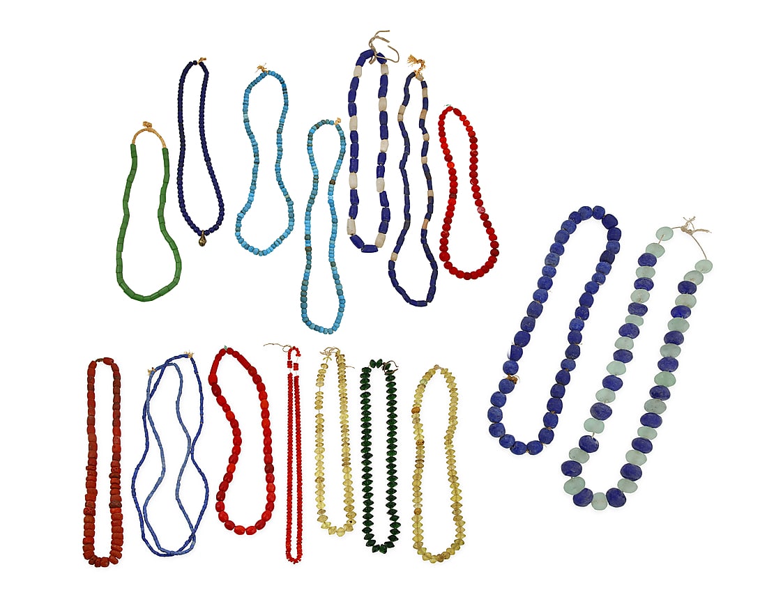 A group of Native American style trade bead necklaces: A group of Native American style trade bead necklaces 20th century or earlier Comprising six single strands featuring blue or green glass trade beads including padre beads, four single strands featuri