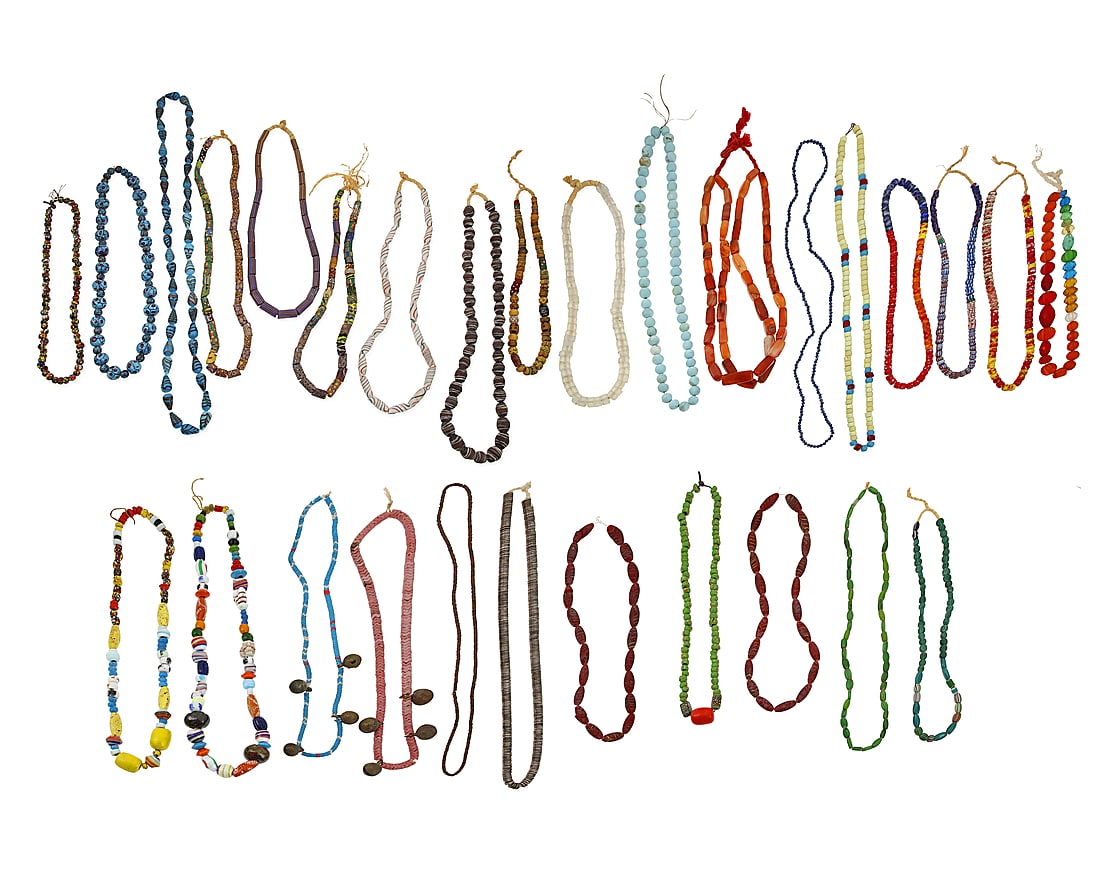 A large group of trade bead necklaces and strands: A large group of trade bead necklaces and strands 20th century Comprising multiple strands and necklaces of various colors and types of beads including glass, ceramic, millefiori beads, striped cerami
