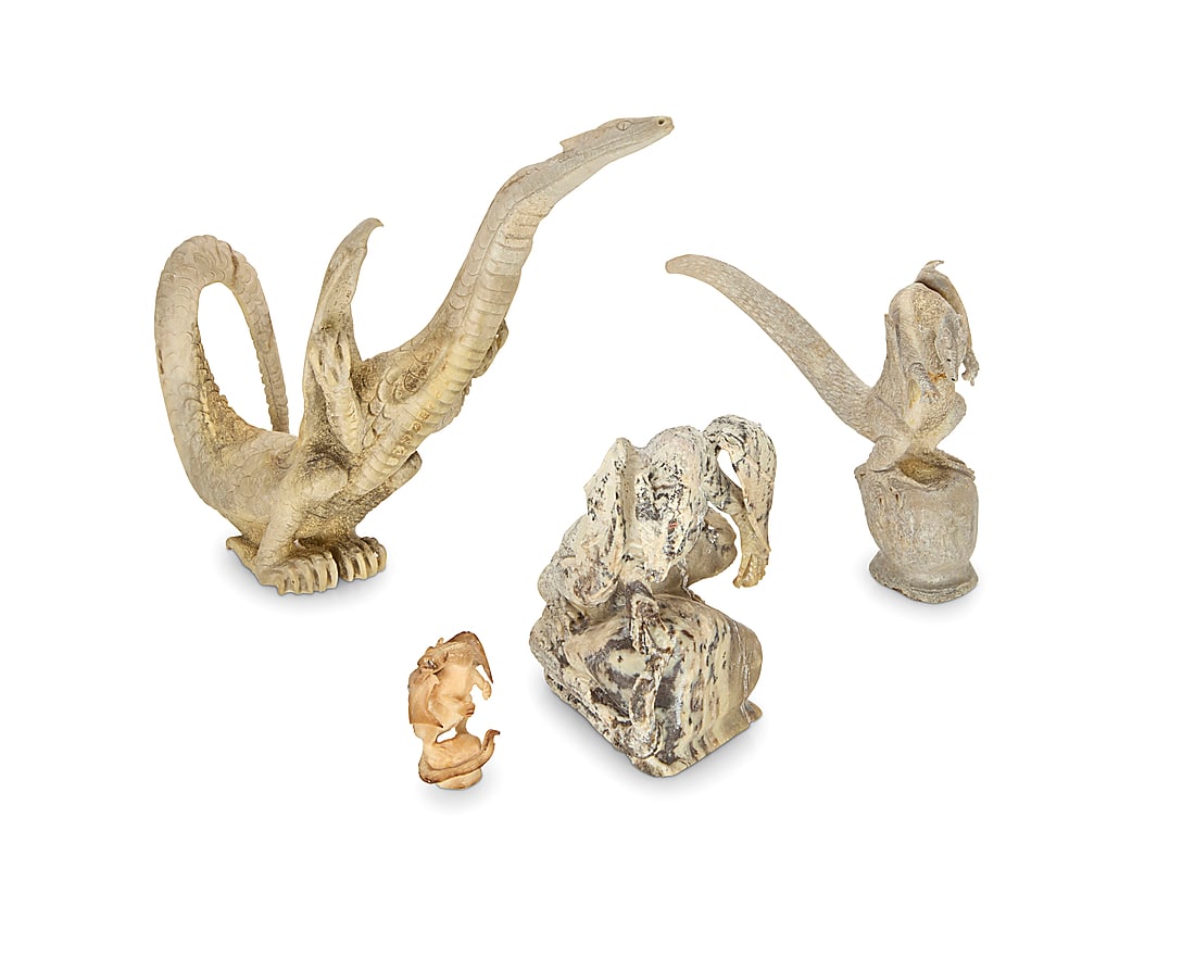 Four Zuni carved dragon fetishes: Four Zuni carved dragon fetishes Mid/late 20th century, Zuni Pueblo Most variously incised with signature or initials From artists including Lewis Malie, Max Laate, and Esteban Najera, carved from har