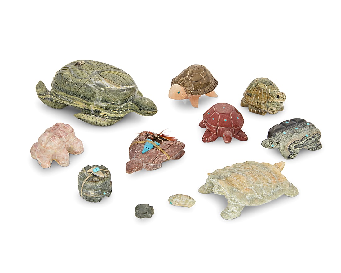 A group of nine Zuni carved stone turtle and frog fetishes: A group of nine Zuni carved stone turtle and frog fetishes Mid/late 20th century, mostly Zuni Pueblo Most variously incised with signature, initials, or artist's cipher From artists including Louise S