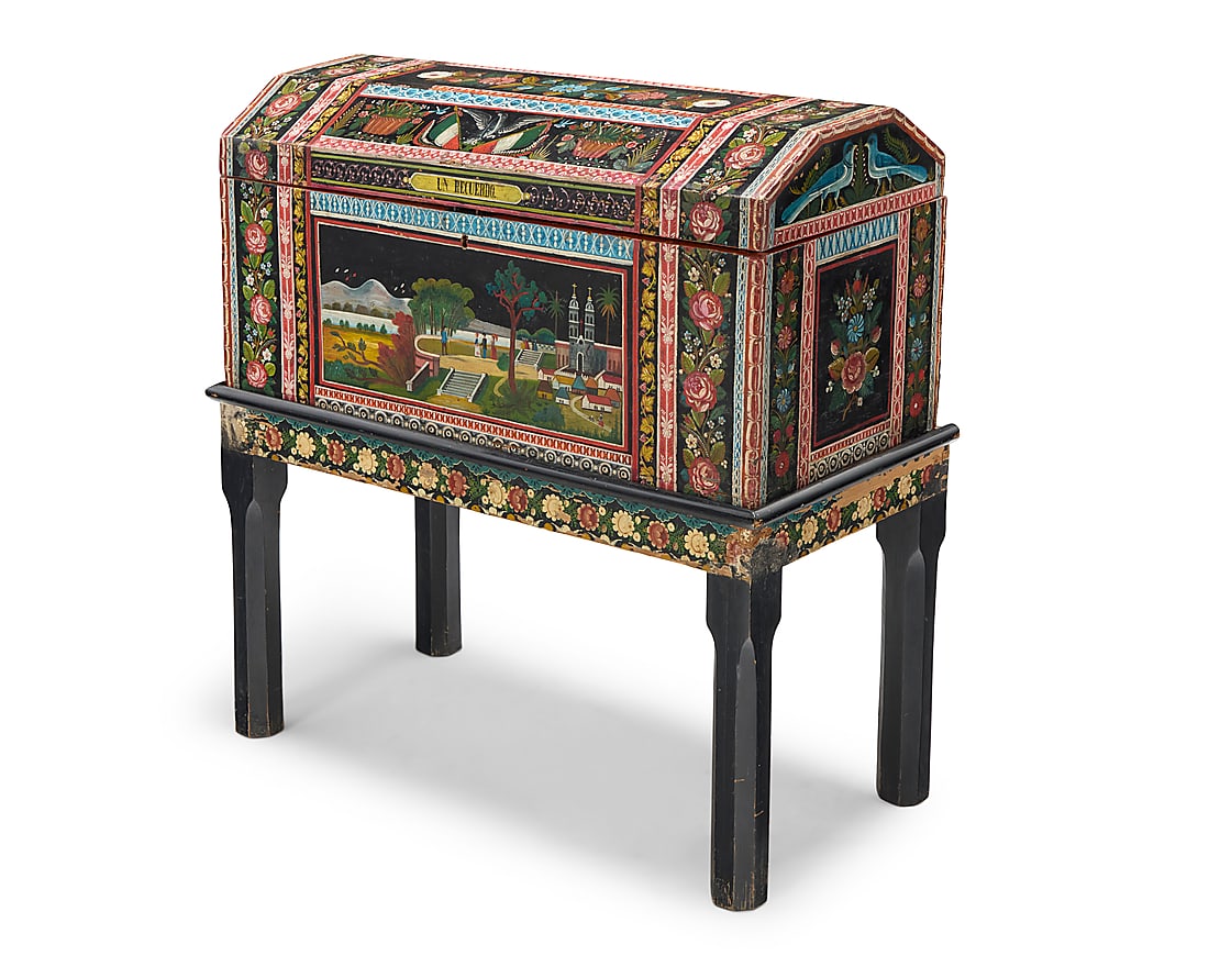 A Mexican Olinala lacquered wood wedding chest: A Mexican Olinala lacquered wood wedding chest 20th century; Guerrero, Mexico Inscribed in a cartouche at front: UN RECUERDO Lacquered wood with locking hinged lid, hand-painted floral elements and